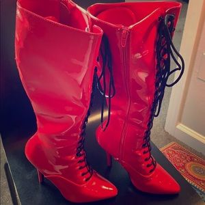 Red patent knee high boots